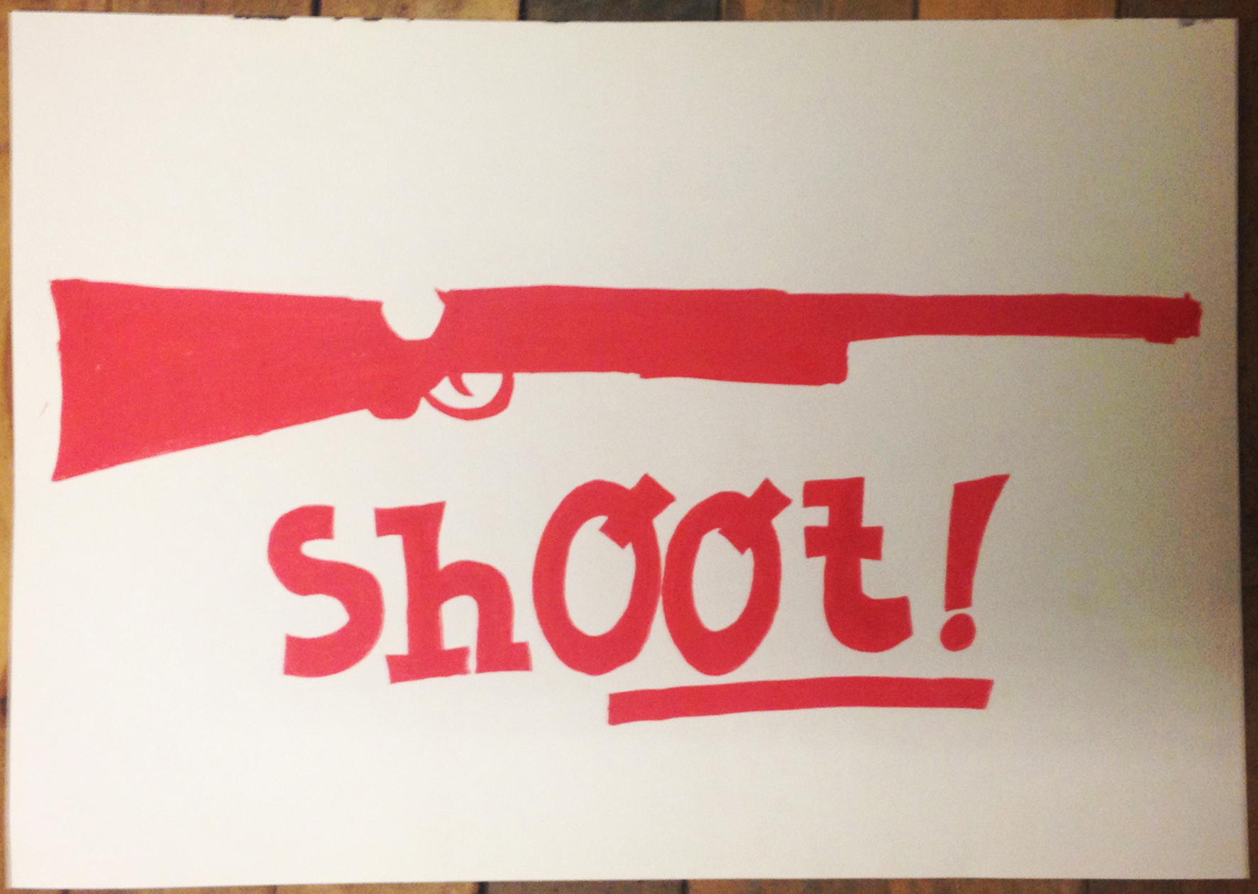 Photographie d'un dessin au Posca® du plasticien Philippe Pitet dans le cadre d'Imagerie de combat. Dessin intitulé "Shoot!"